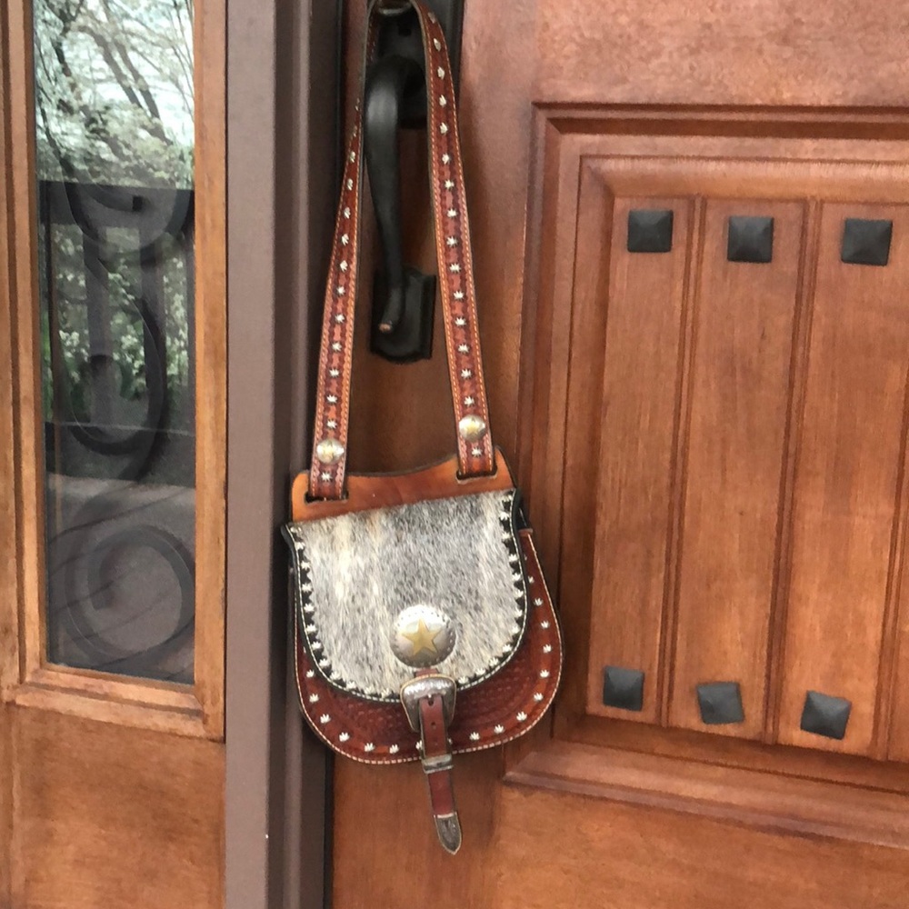 Hair on hide and tooled leather purse.